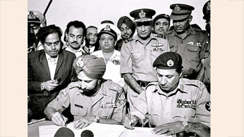 Lt. Gen. A. A. K. Niazi signing the Instrument of Surrender to Lt. Gen. Jagjit Singh Aurora, marking the end of the Bangladesh Liberation War. (Cropped version of image from Indian navy website)